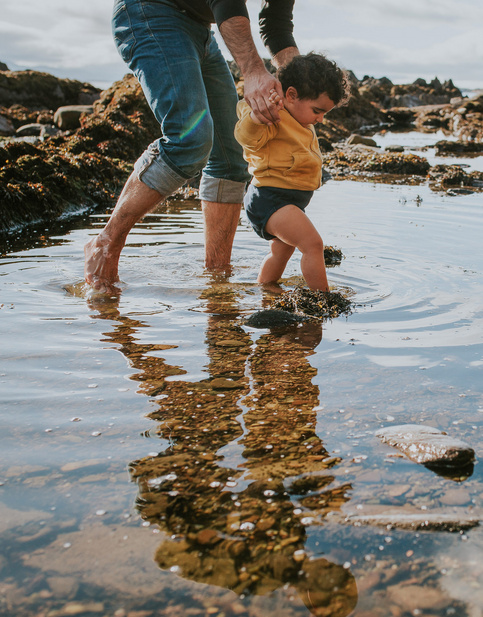 baby steps in pond with dad 