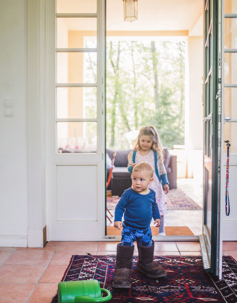 baby playing in the house with sister