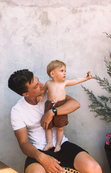 dad holding his kid on lap