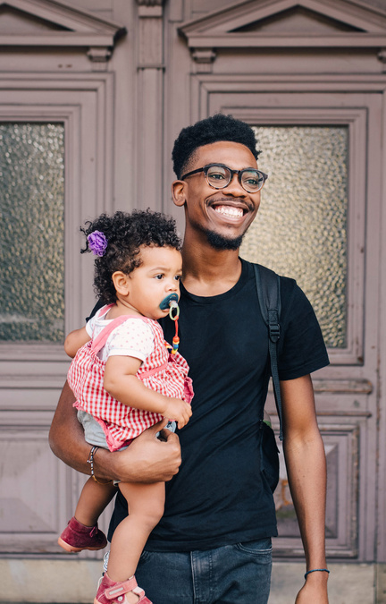 dad carrying his baby 